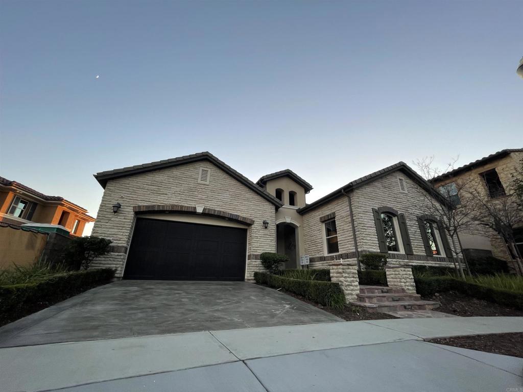 a front view of a house with yard