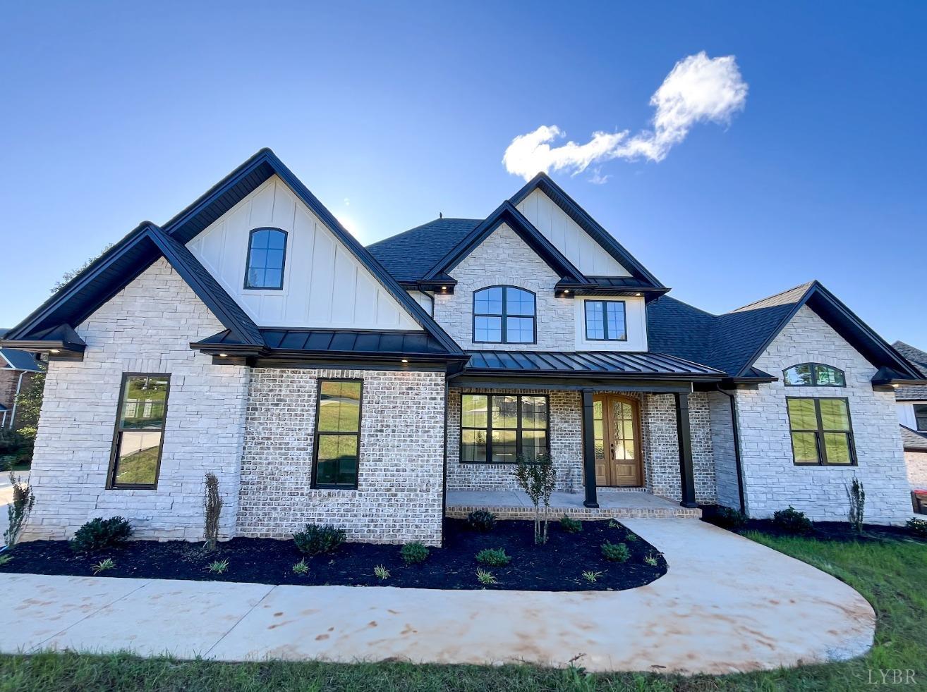 a front view of a house with yard