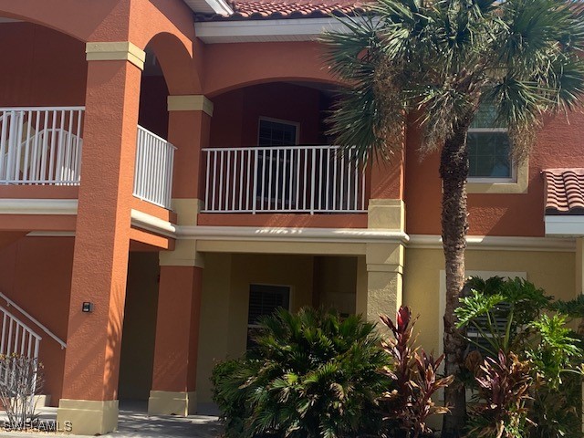 a view of a house with a small yard