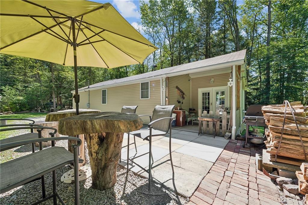 a patio with a patio table and chairs