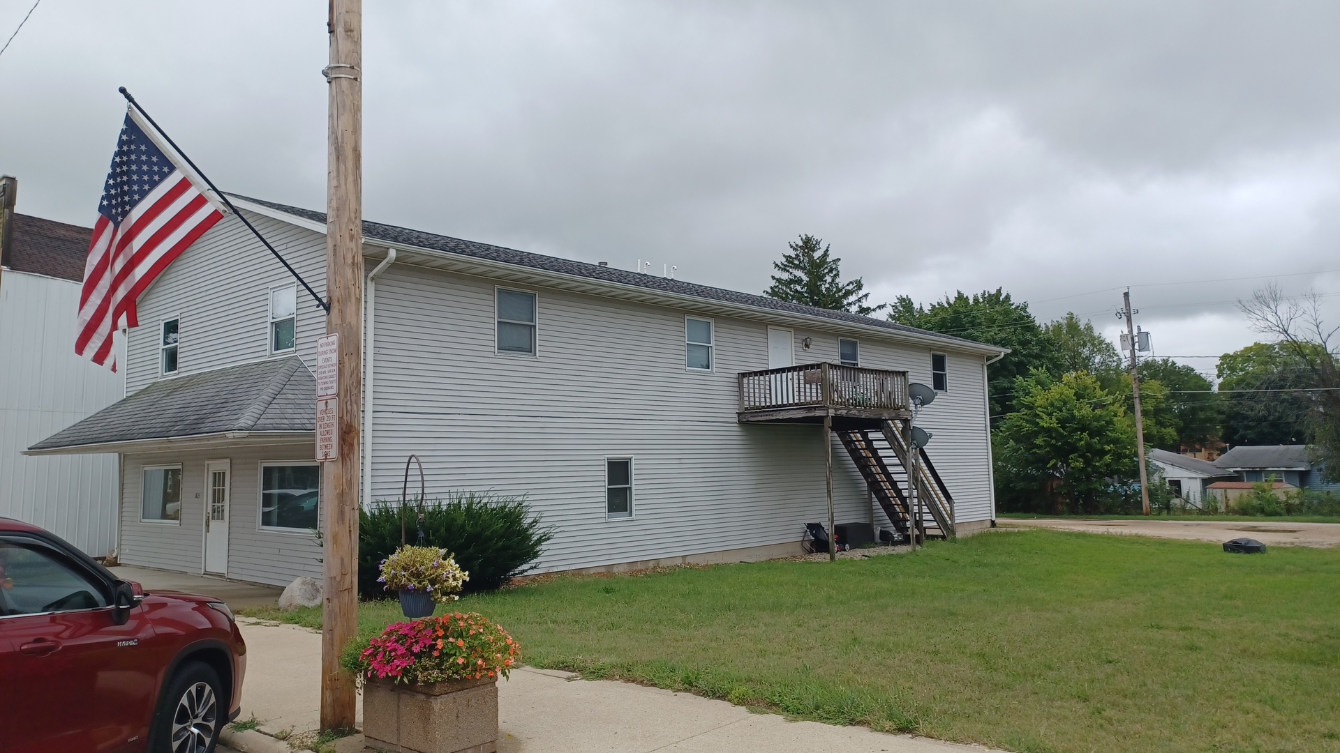 a front view of house with yard and outdoor seating