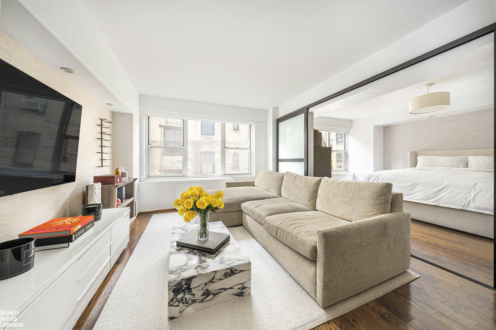 a living room with furniture and a flat screen tv