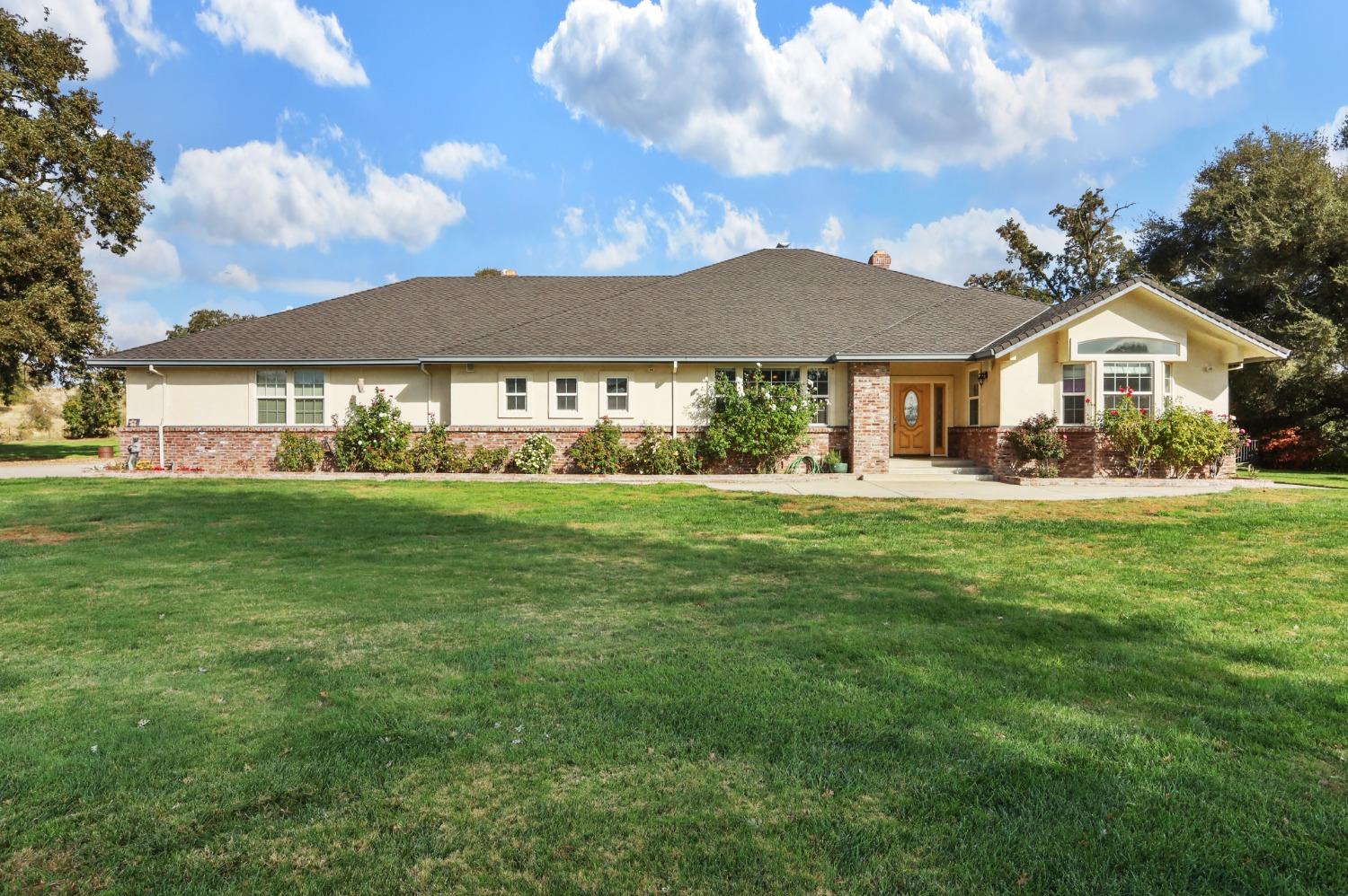 a front view of a house with a yard