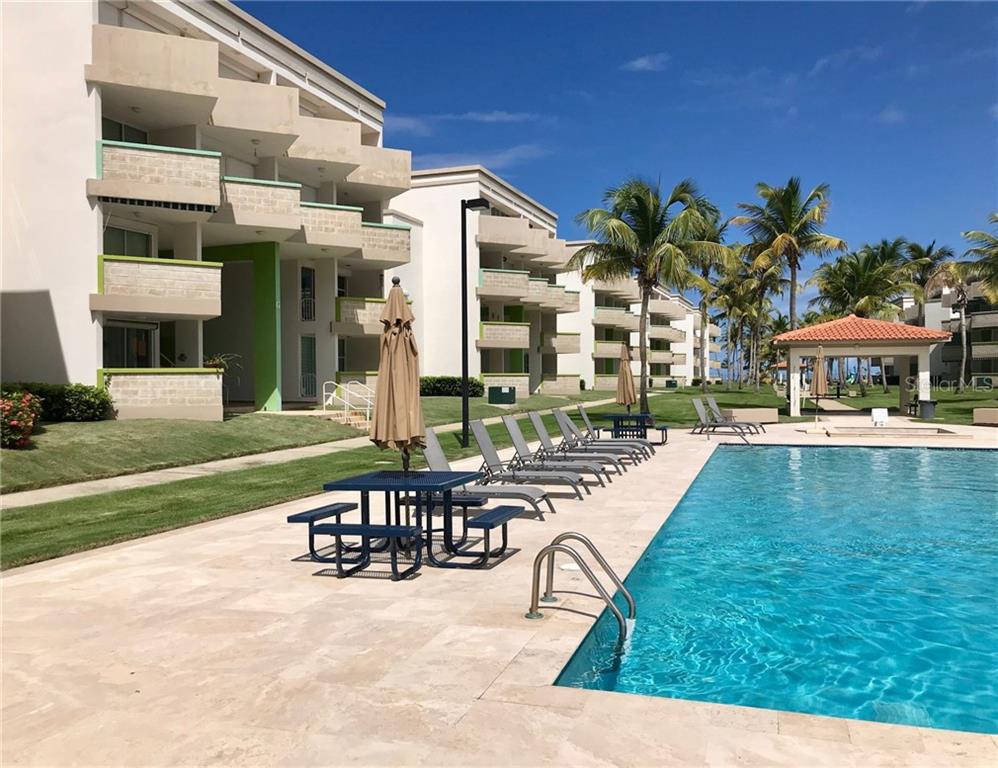 a view of a swimming pool with a lounge chair