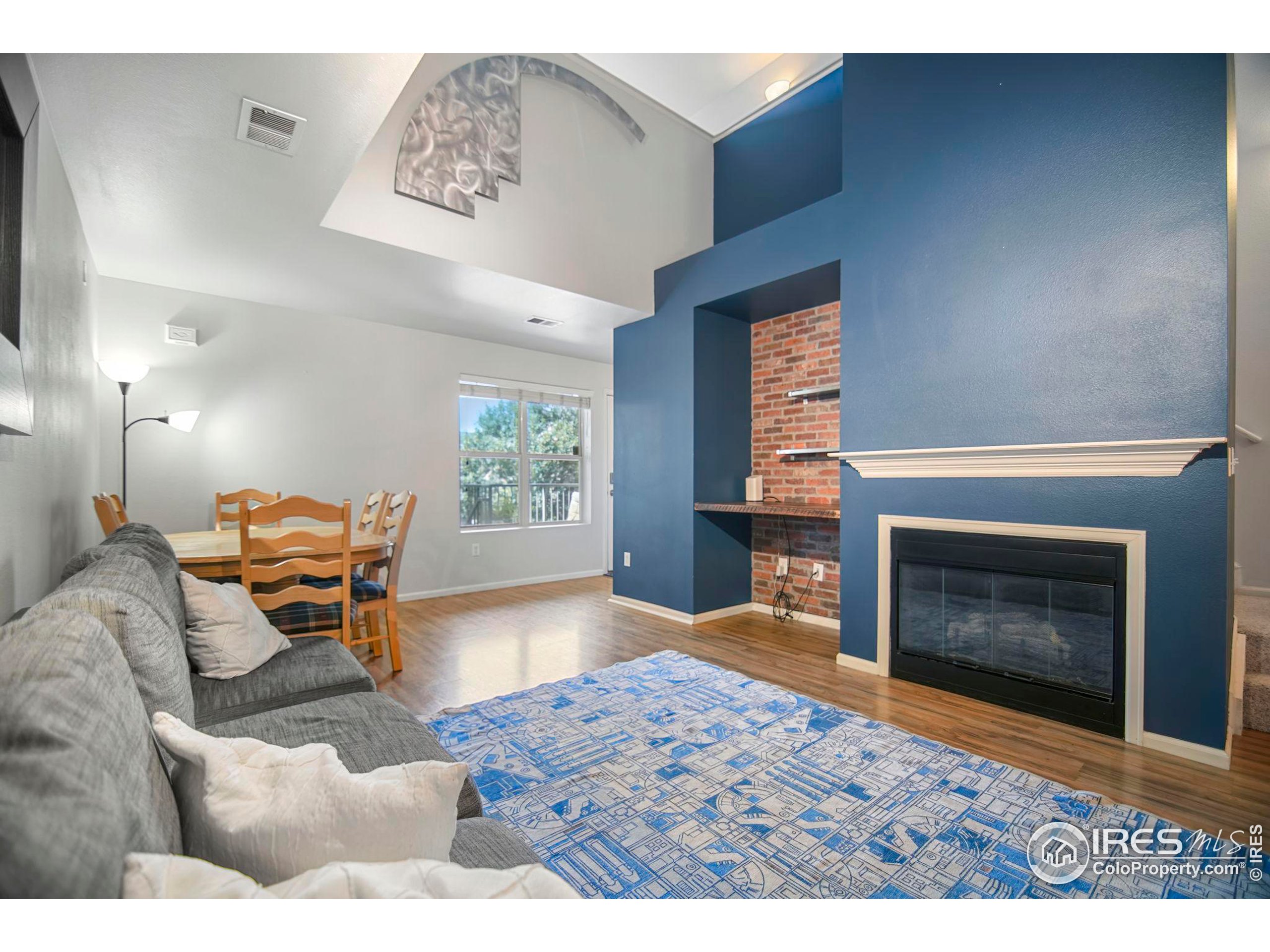 a bedroom with furniture and a fireplace