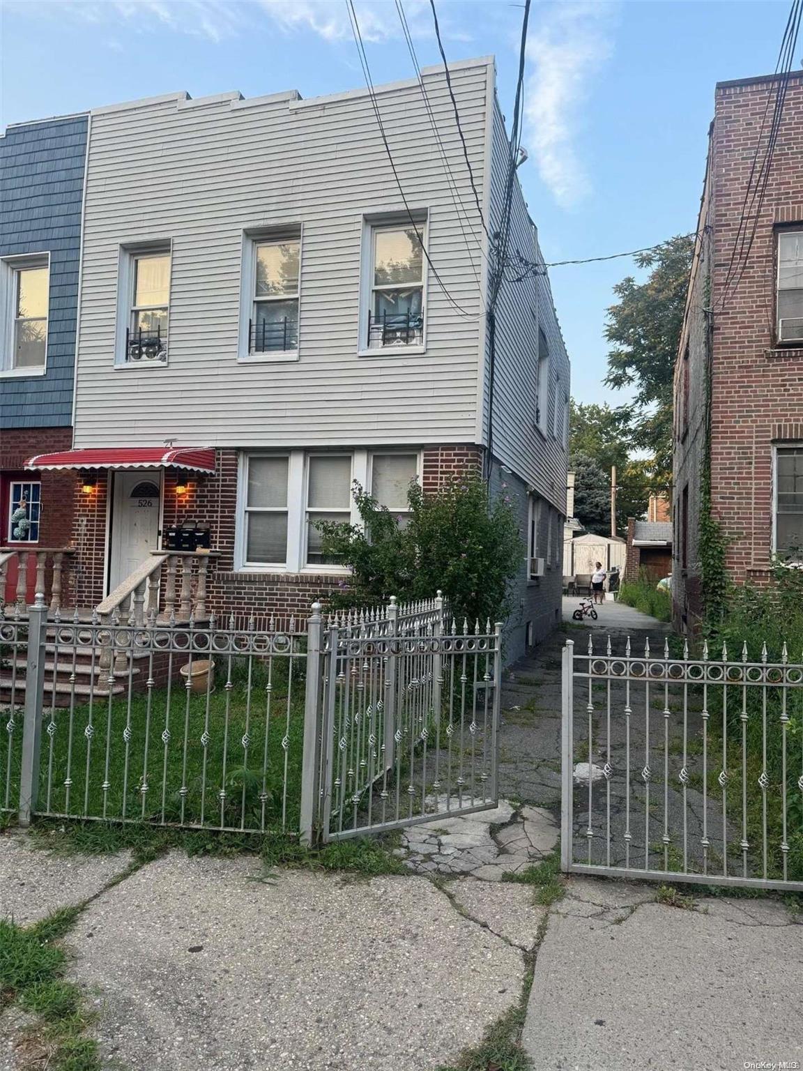 front view of a house with a garden