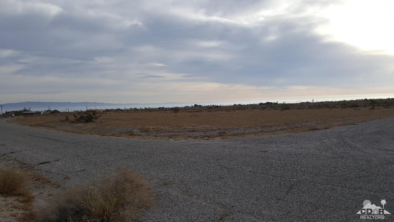 a view of an ocean beach and mountain