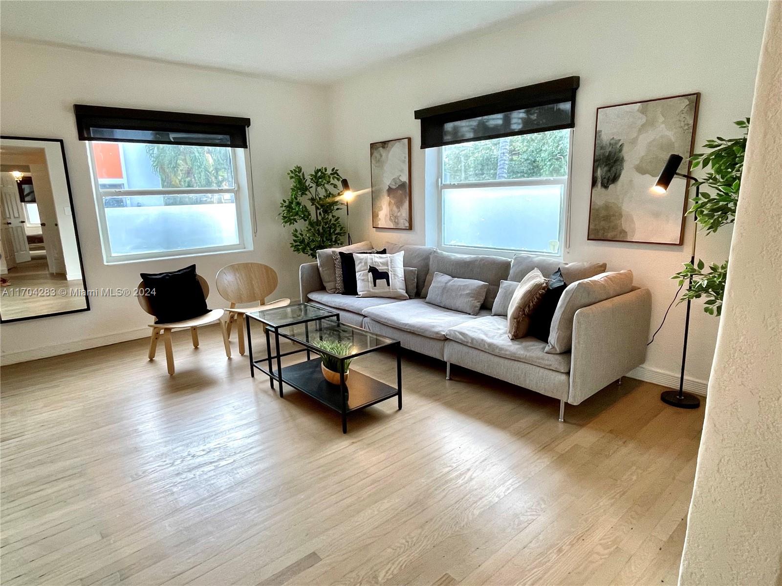 a living room with furniture and a window