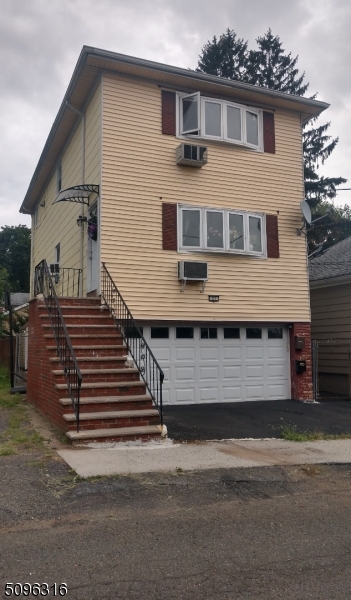 a front view of a house with a garage