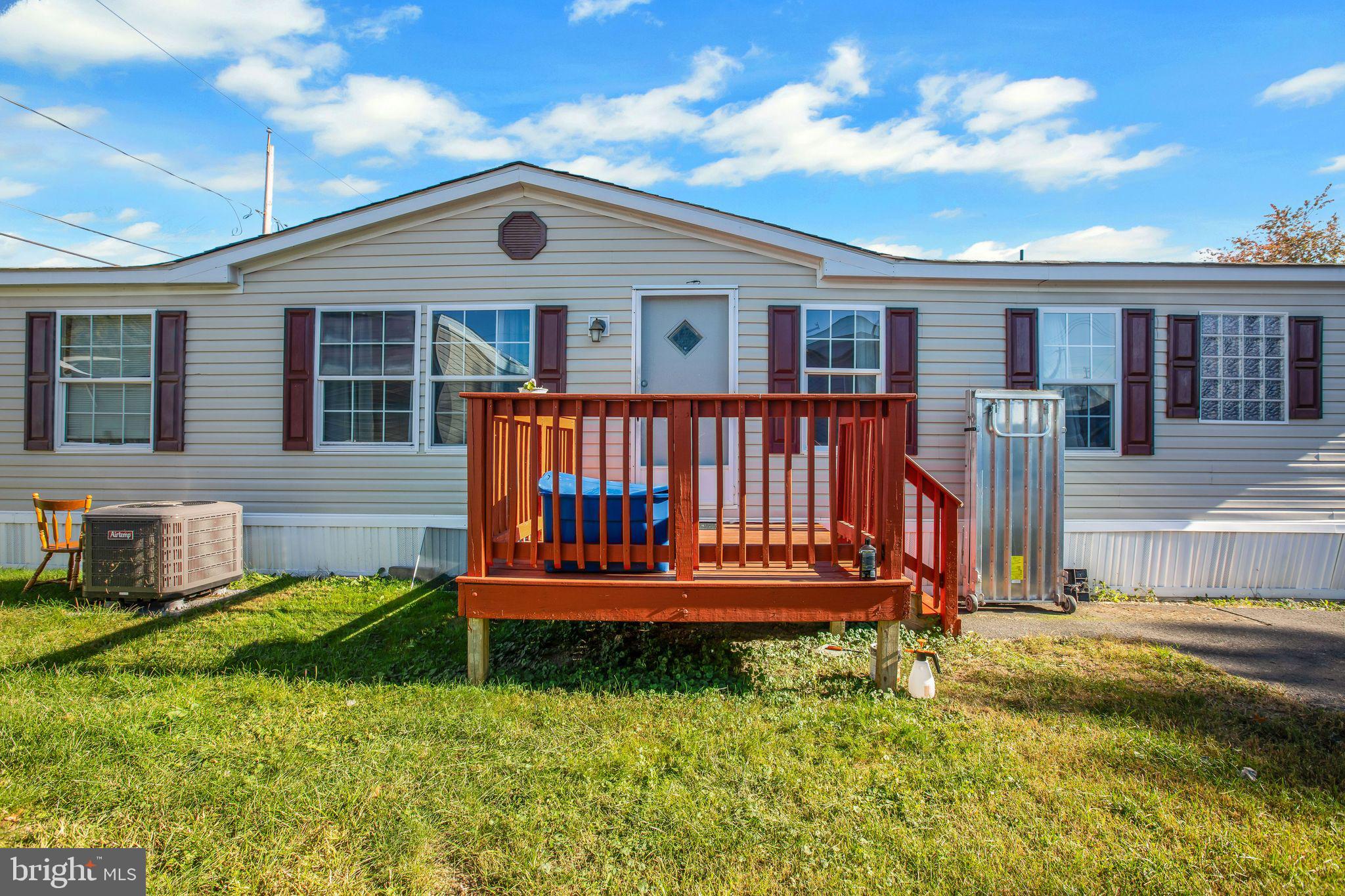 a front view of a house with a yard table and chairs