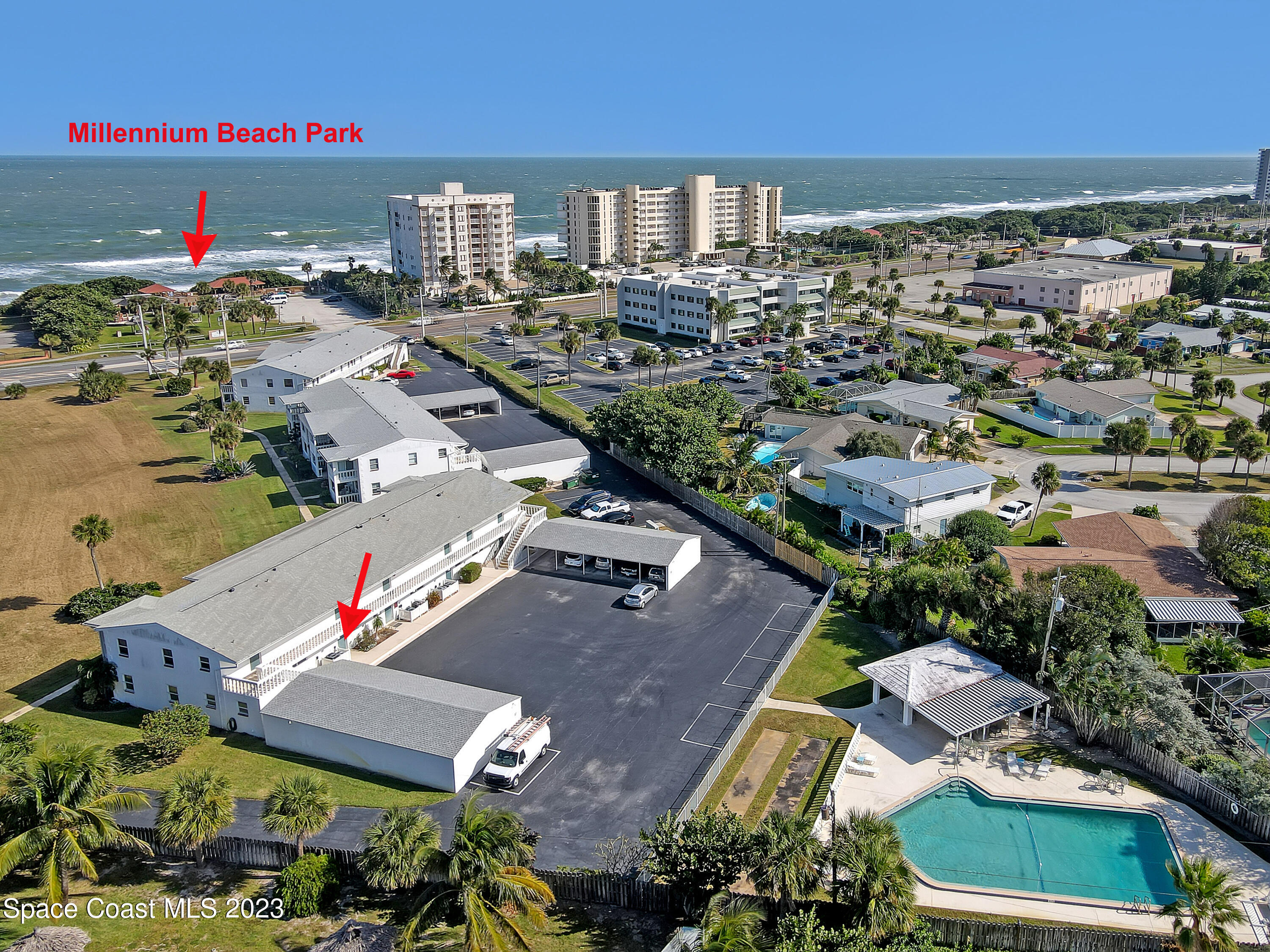 an aerial view of residential houses with outdoor space