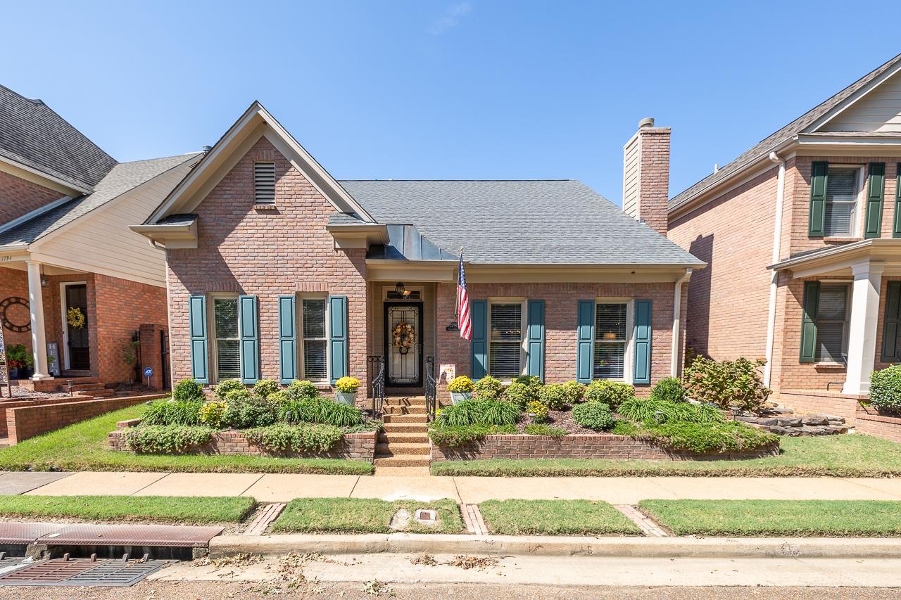 front view of a house with a yard