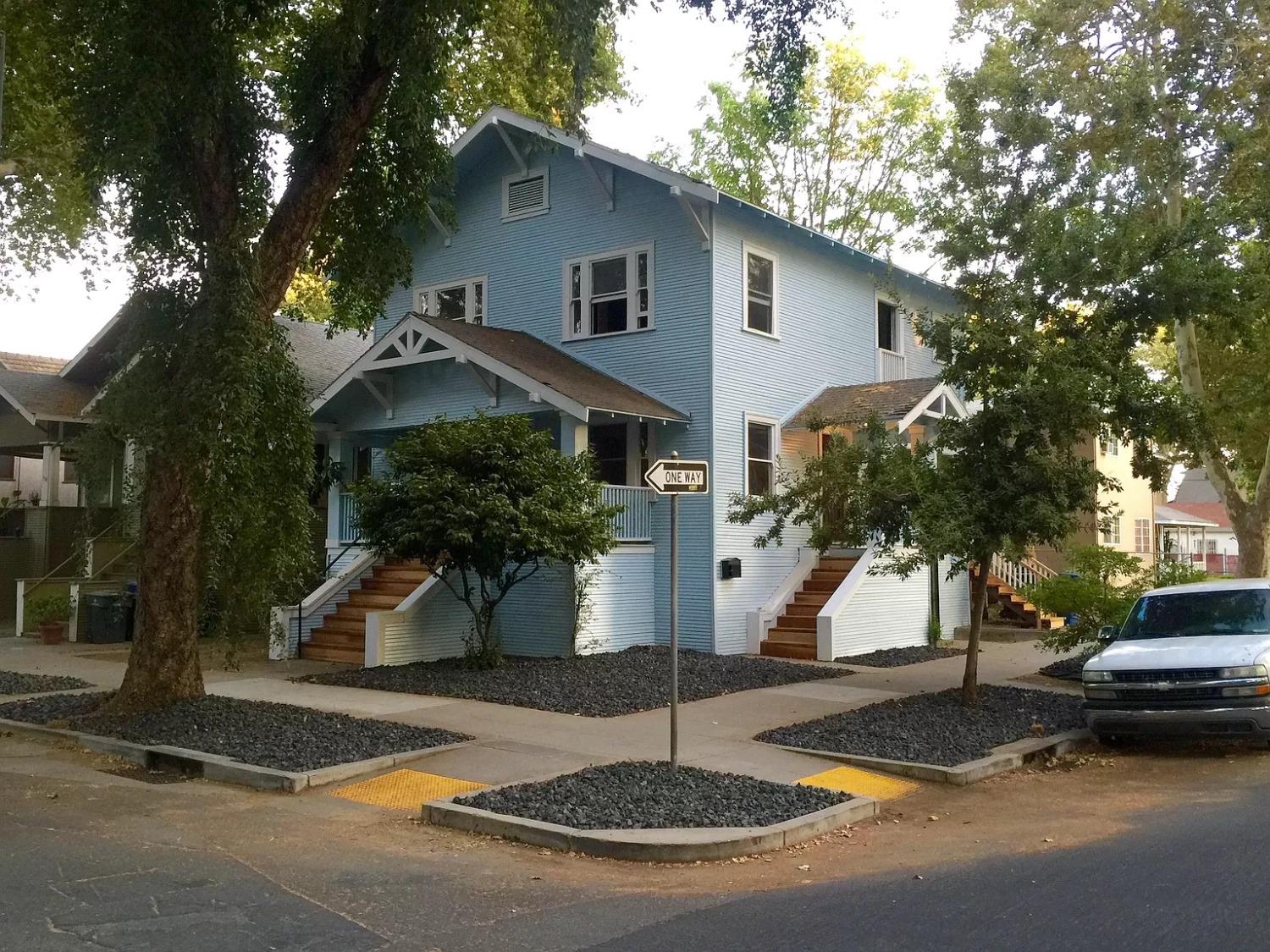 a front view of a house with garden