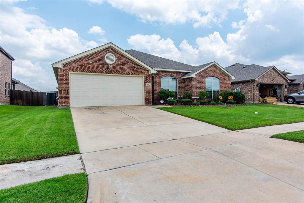 a front view of a house with yard