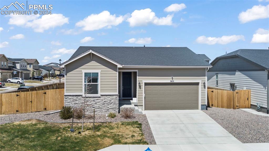 a front view of a house with garage