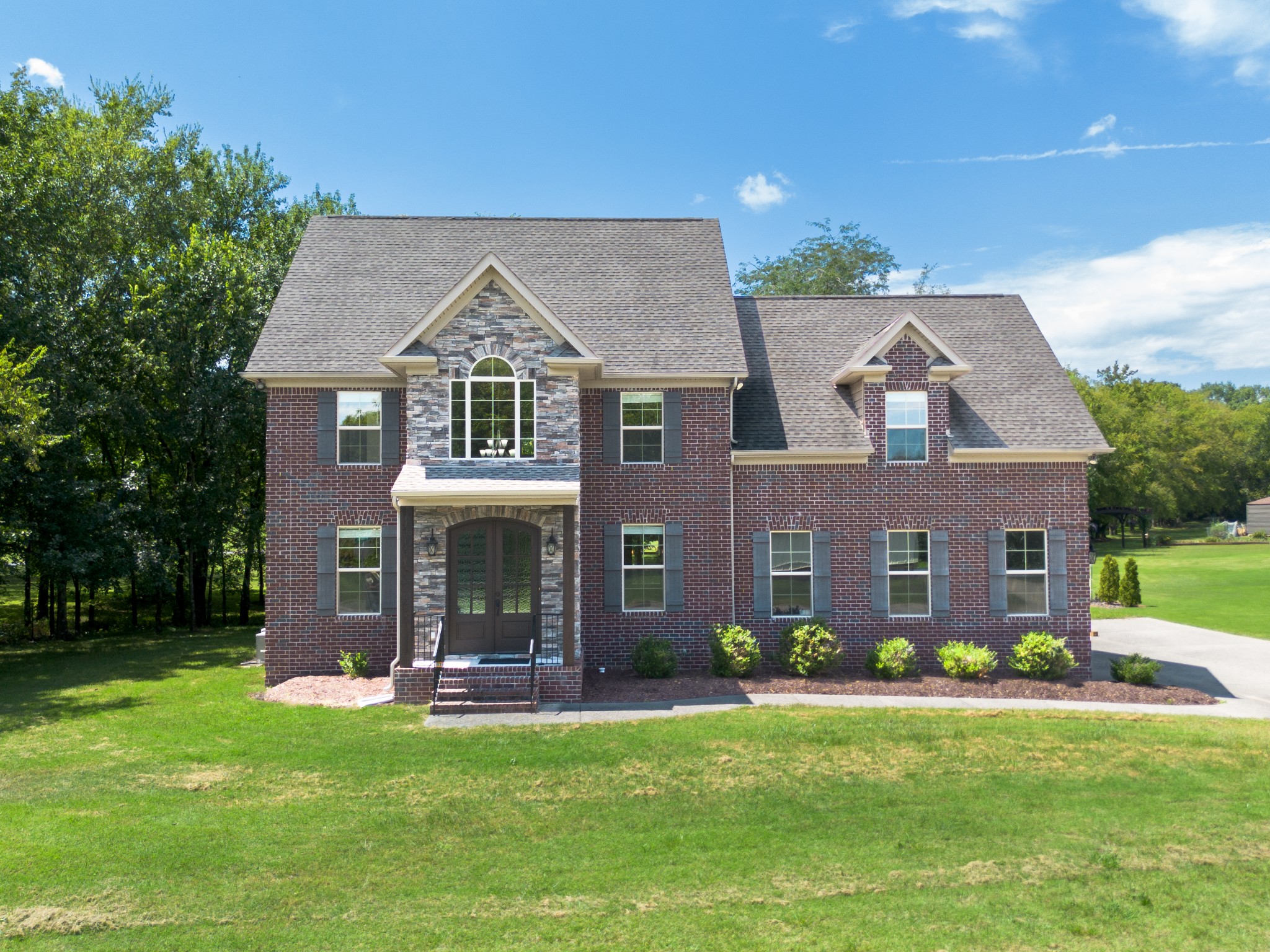 front view of a house with a yard