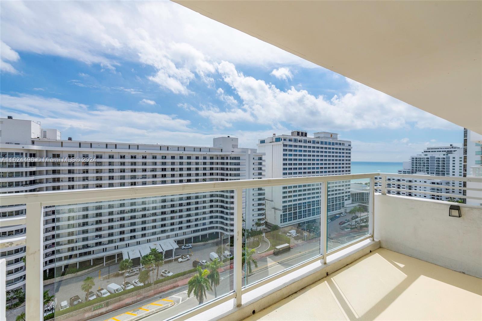 a view of a balcony with a floor to ceiling window