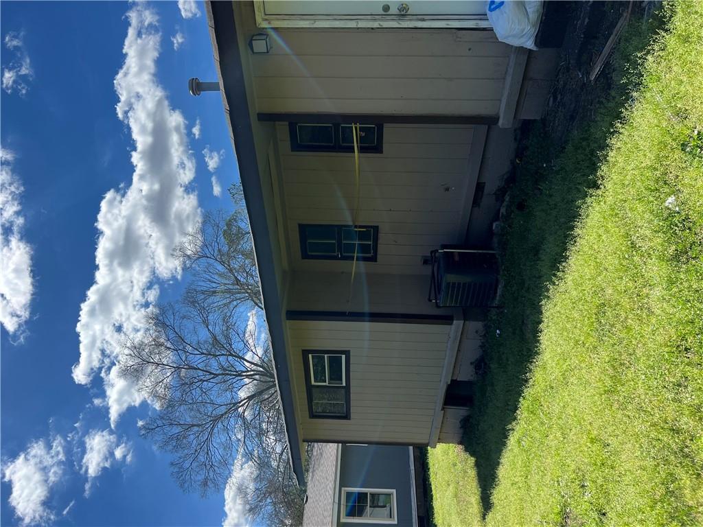 a view of a backyard with a tub