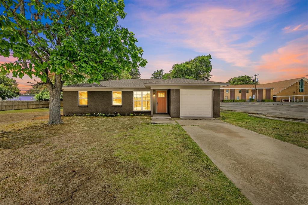 front view of a house with a yard