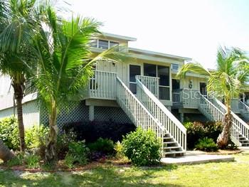 a view of a house with iron stairs