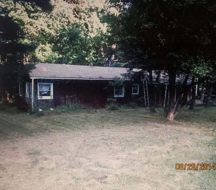 a view of a house with a tree