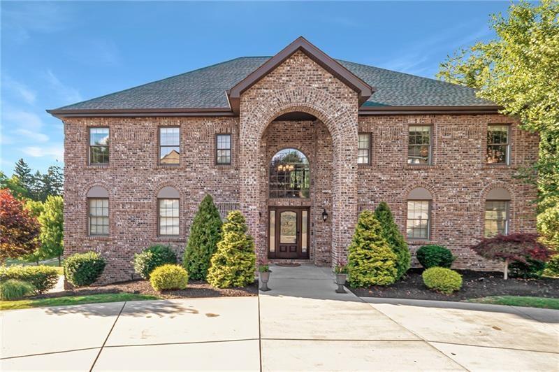 9 yr young Solid Brick stunner with a governor's driveway!