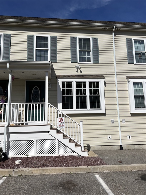 a view of a house with a small white door