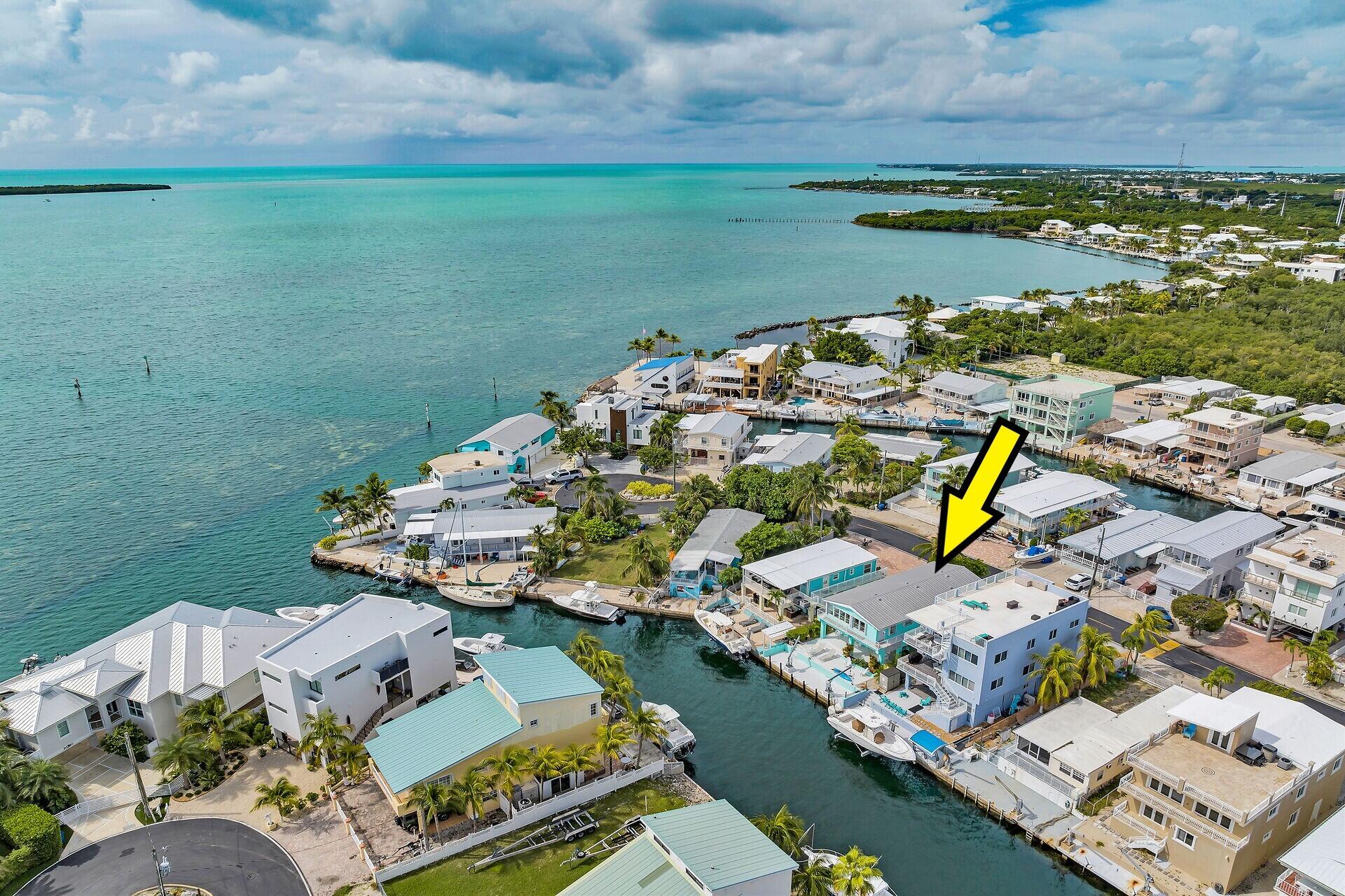 an aerial view of a house with a ocean view