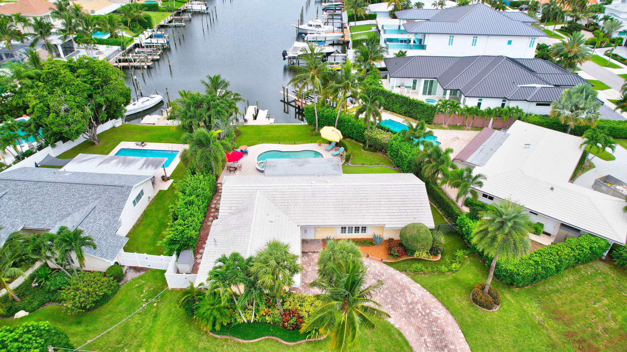 an aerial view of a house with a yard and garden