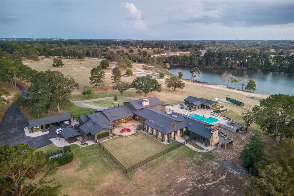 an aerial view of a house with a lake view