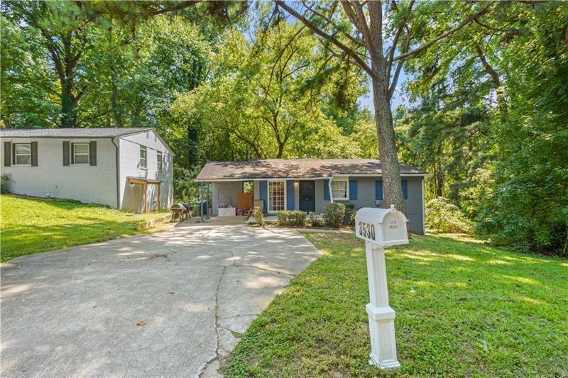 a front view of house with yard nad seating space