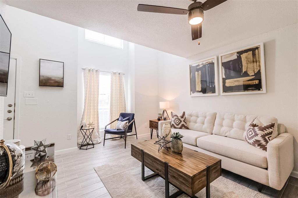 a living room with furniture a couch and dresser