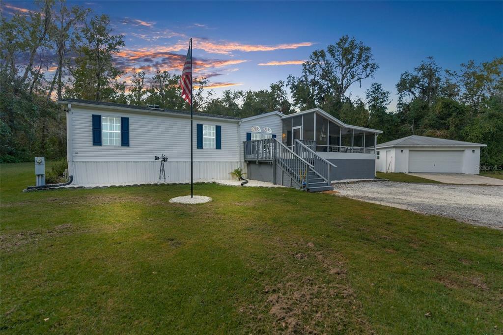 a view of a house with a yard