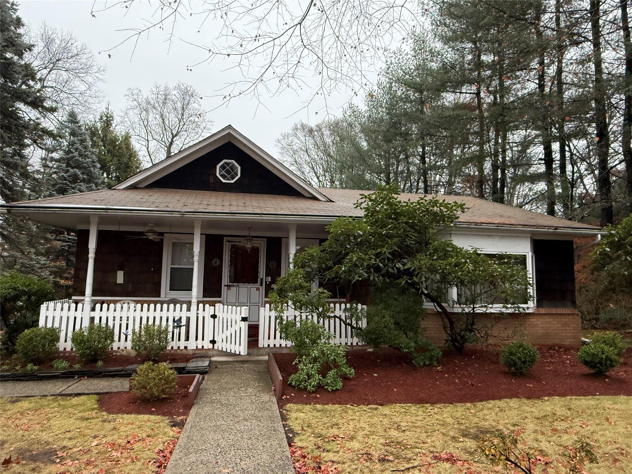 Great curb appeal, a white picket fence and front porch