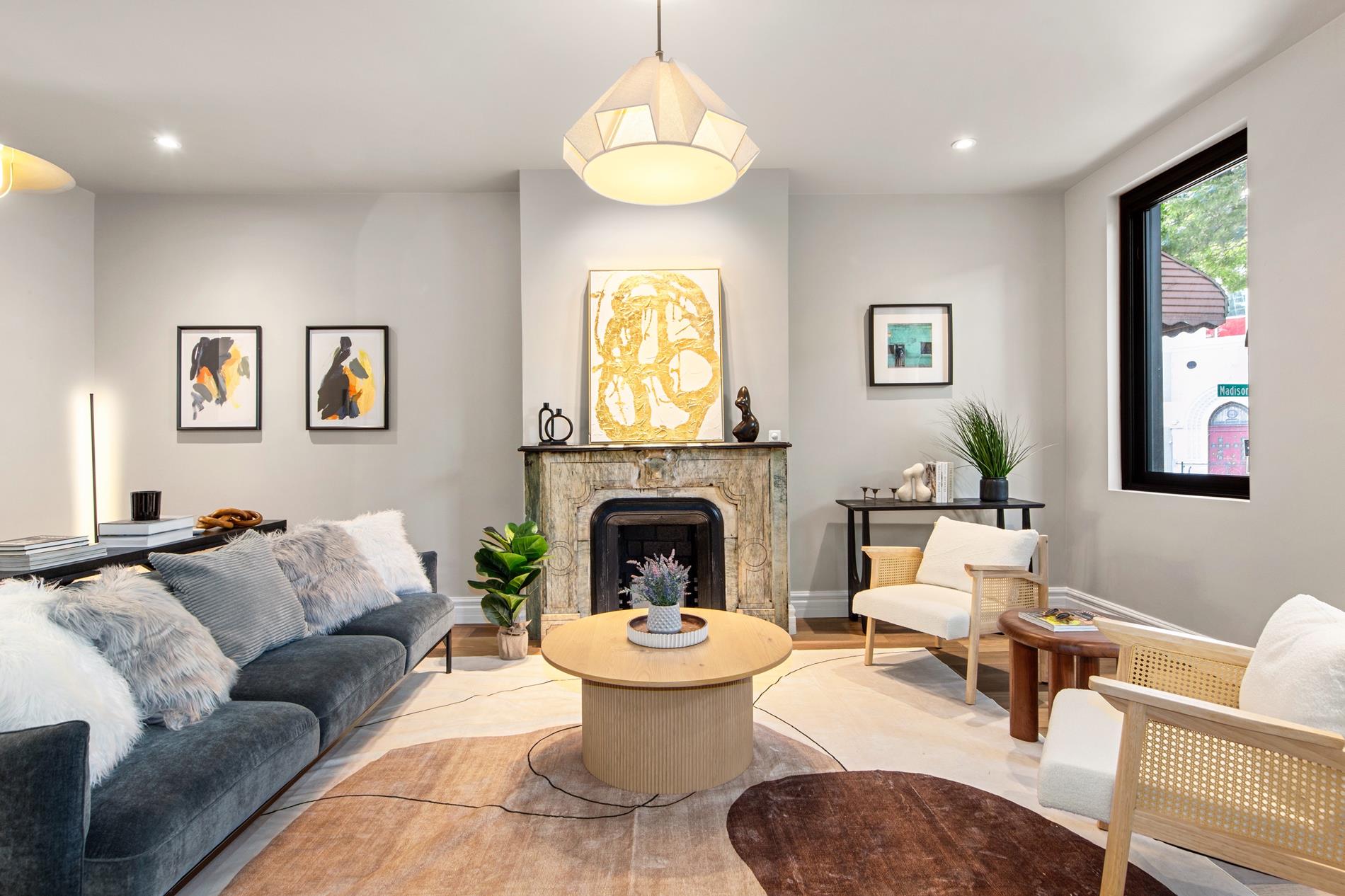 a living room with furniture and a fireplace