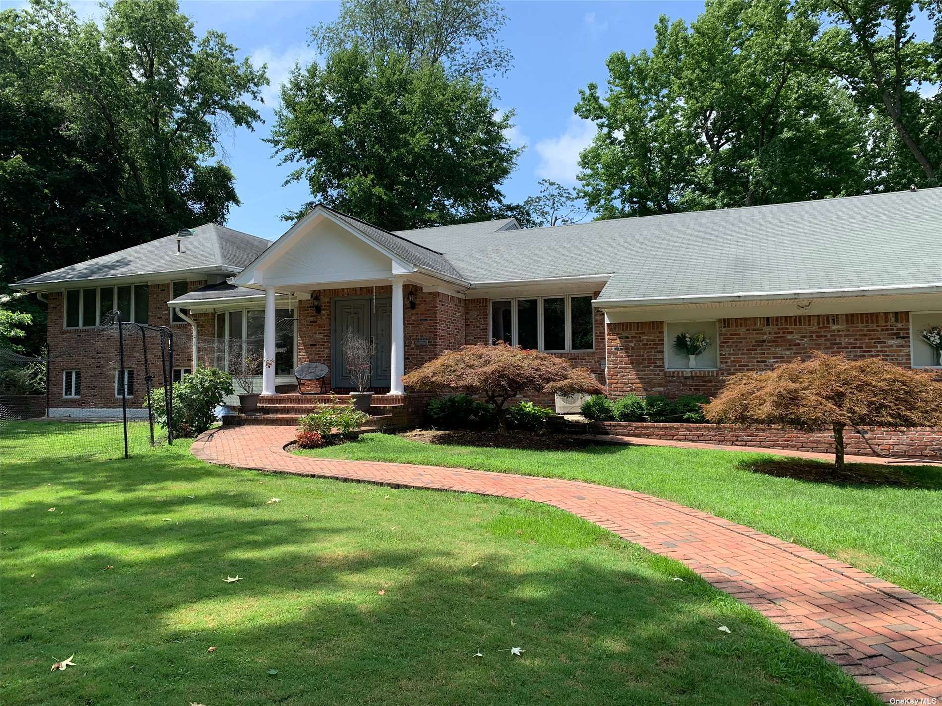 a view of a house with a yard porch and sitting area