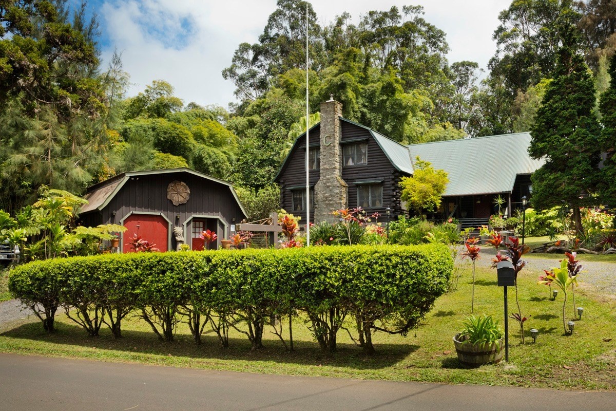 a front view of house with yard and green space