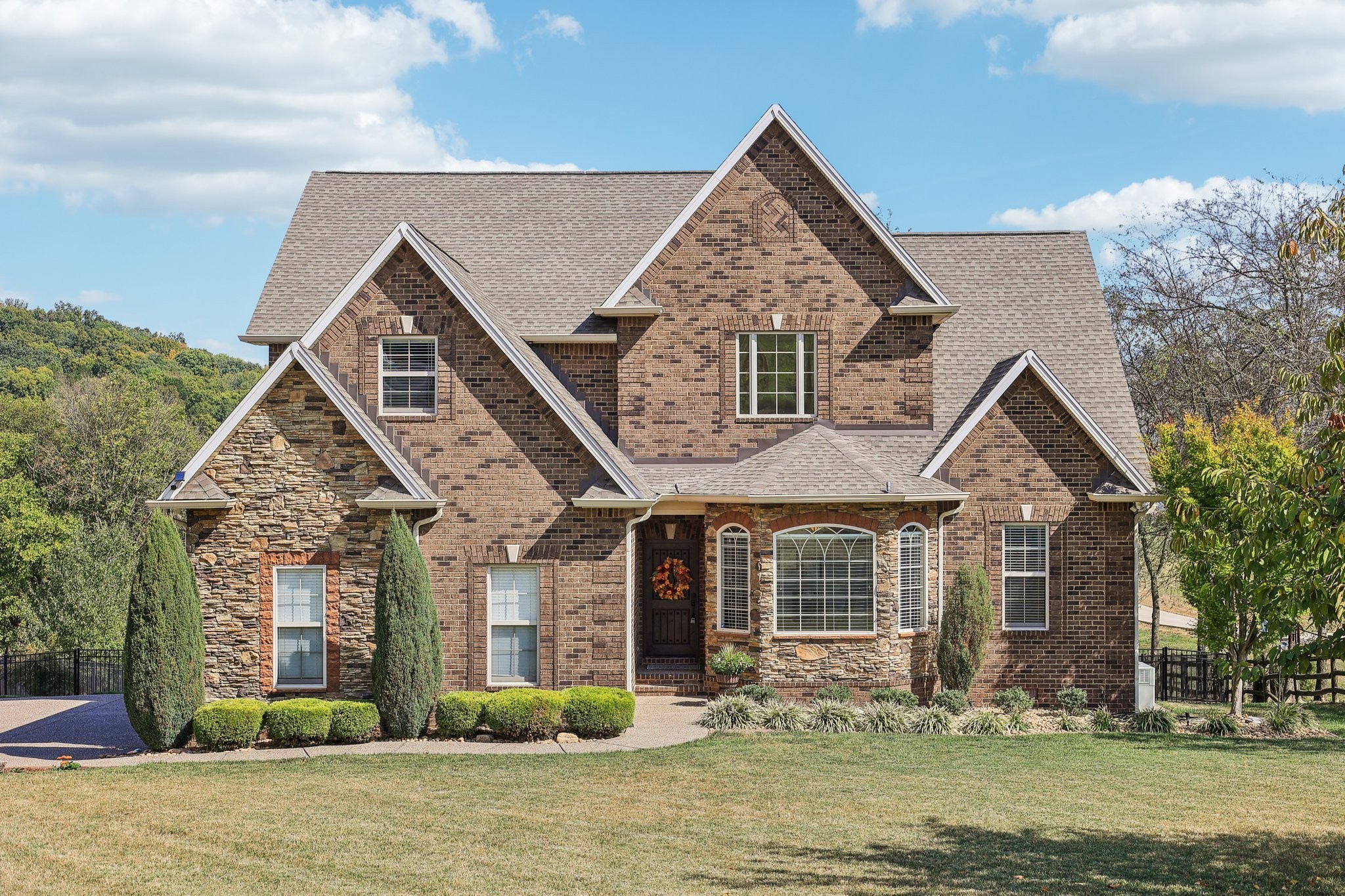 a front view of a house with a yard