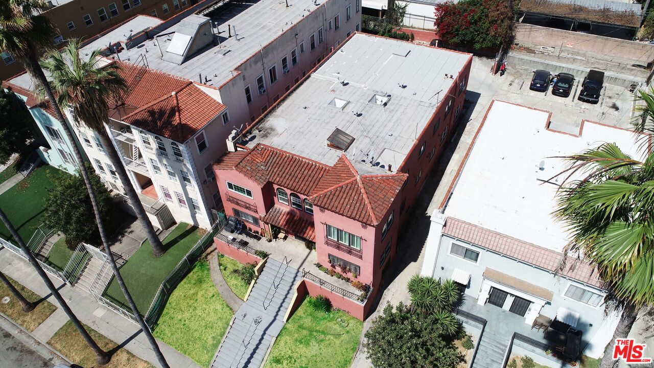 an aerial view of a house with outdoor space and street view