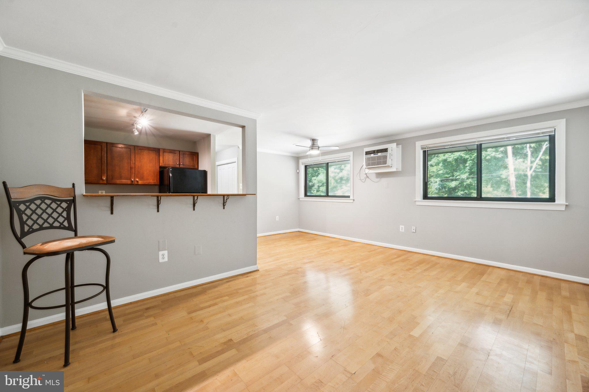 a view of a livingroom with furniture and a window