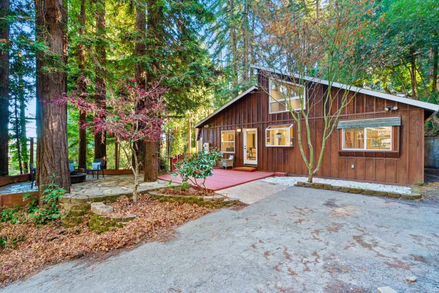 a view of a house with a tree in front