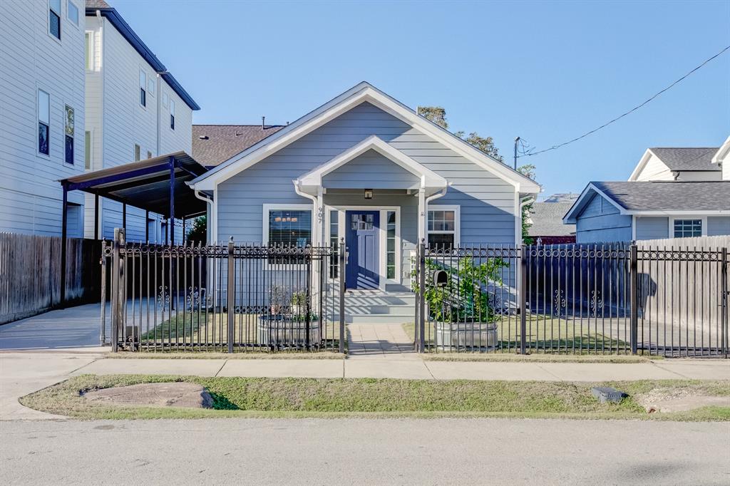 a view of a house with a small yard and plants