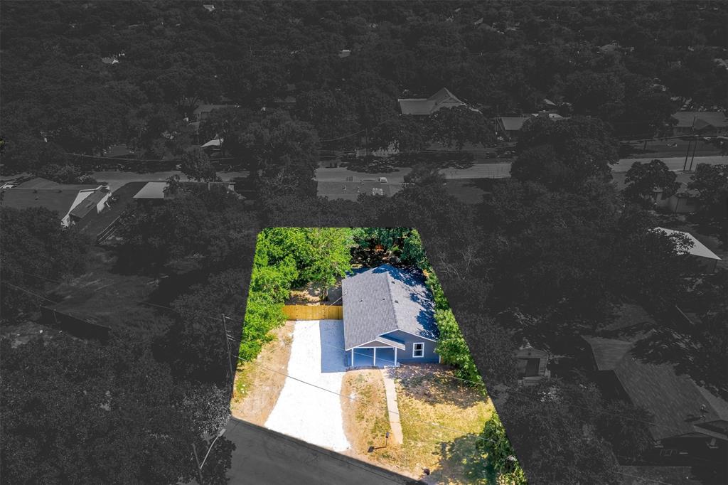 an aerial view of house with yard swimming pool and outdoor seating