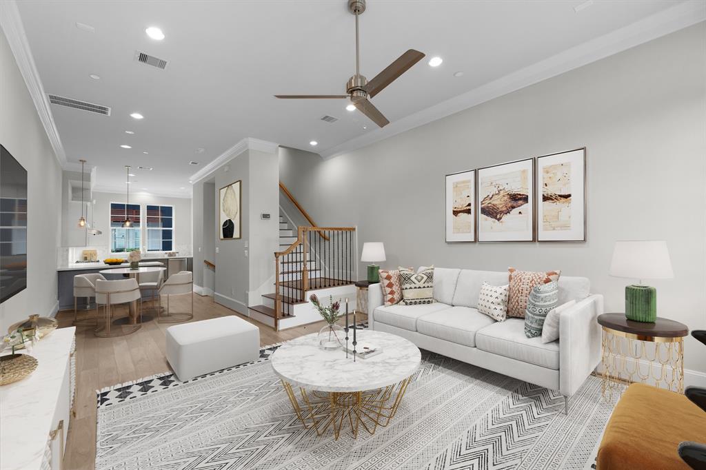 a living room with furniture and kitchen view