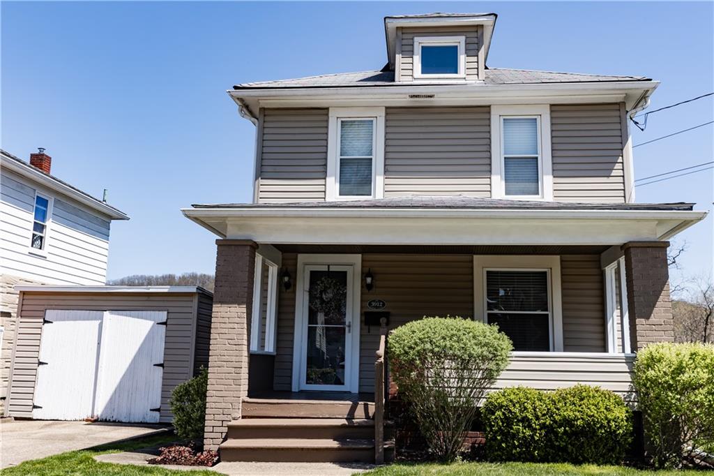 a front view of a house with yard