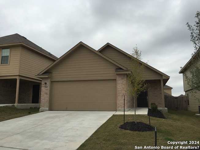 a front view of a house with a garage