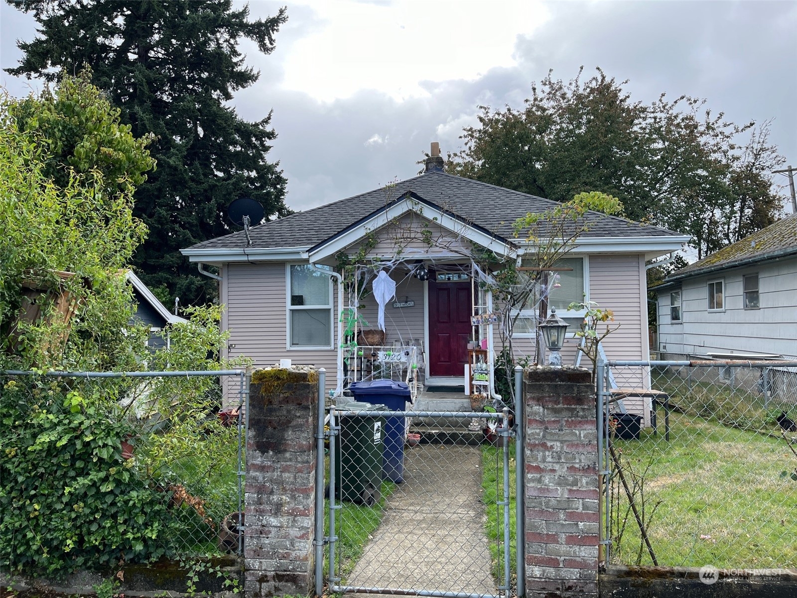 a front view of a house with garden