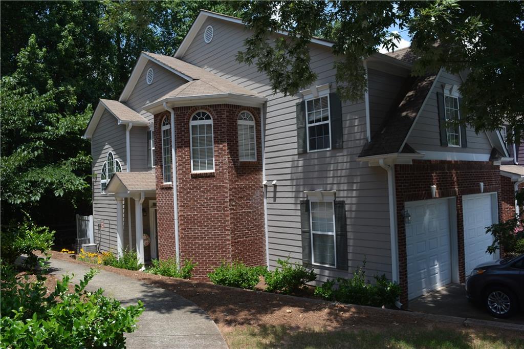 Great End Unit with brick accents and a 2 car garage!