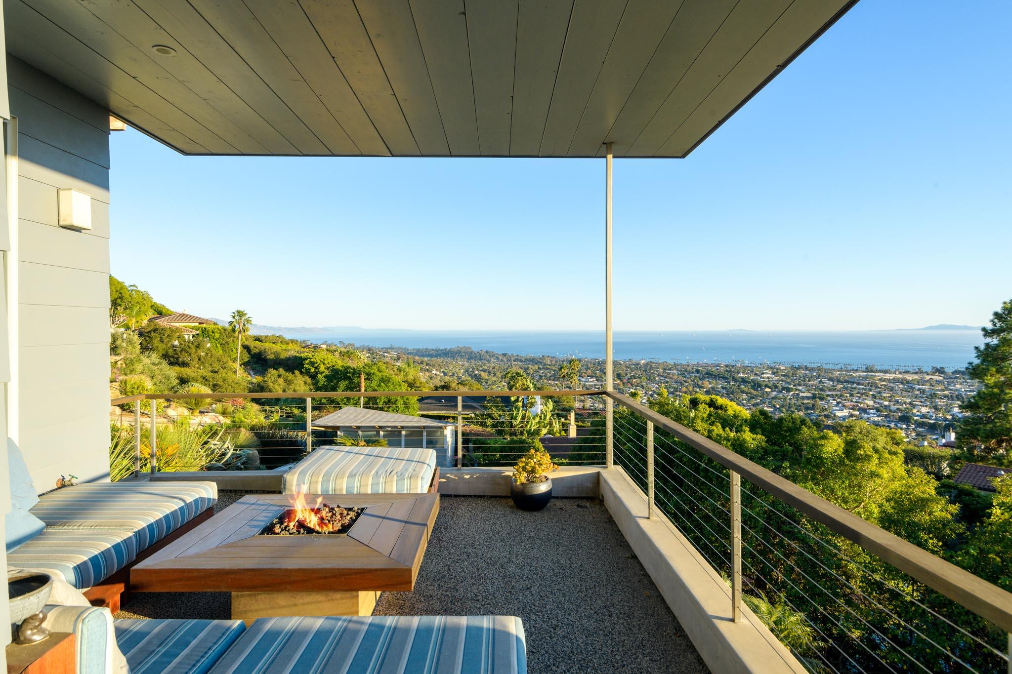 a view of a balcony with an ocean view