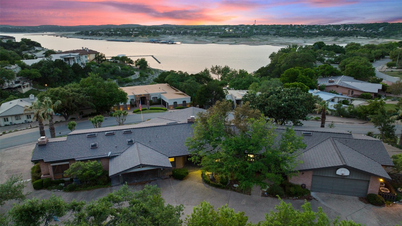 an aerial view of houses with yard